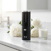 CordlessCurl wireless curling wand on white marble vanity with peonies